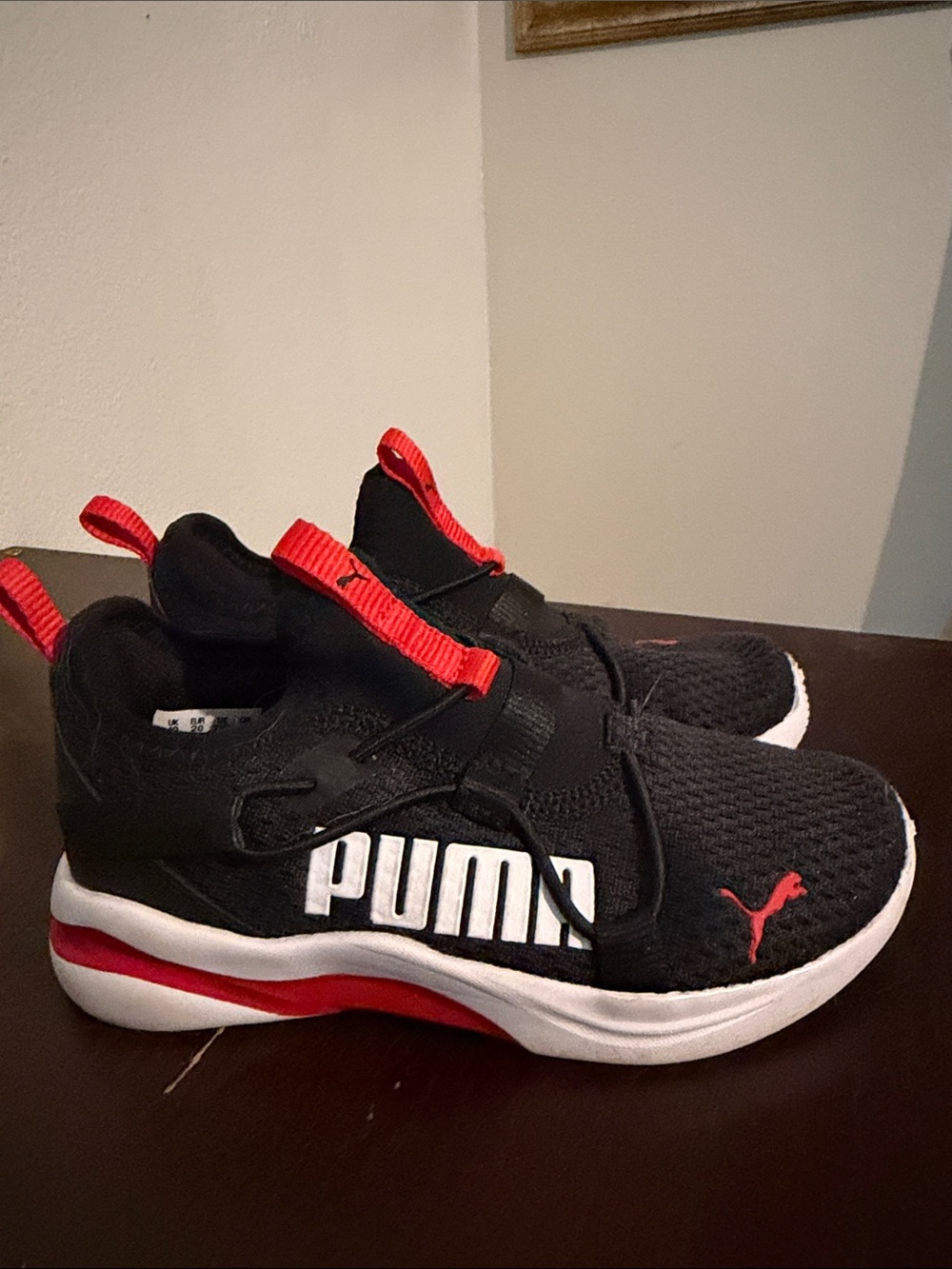 Puma Kids Black Sneakers with Red Accents and White Sole